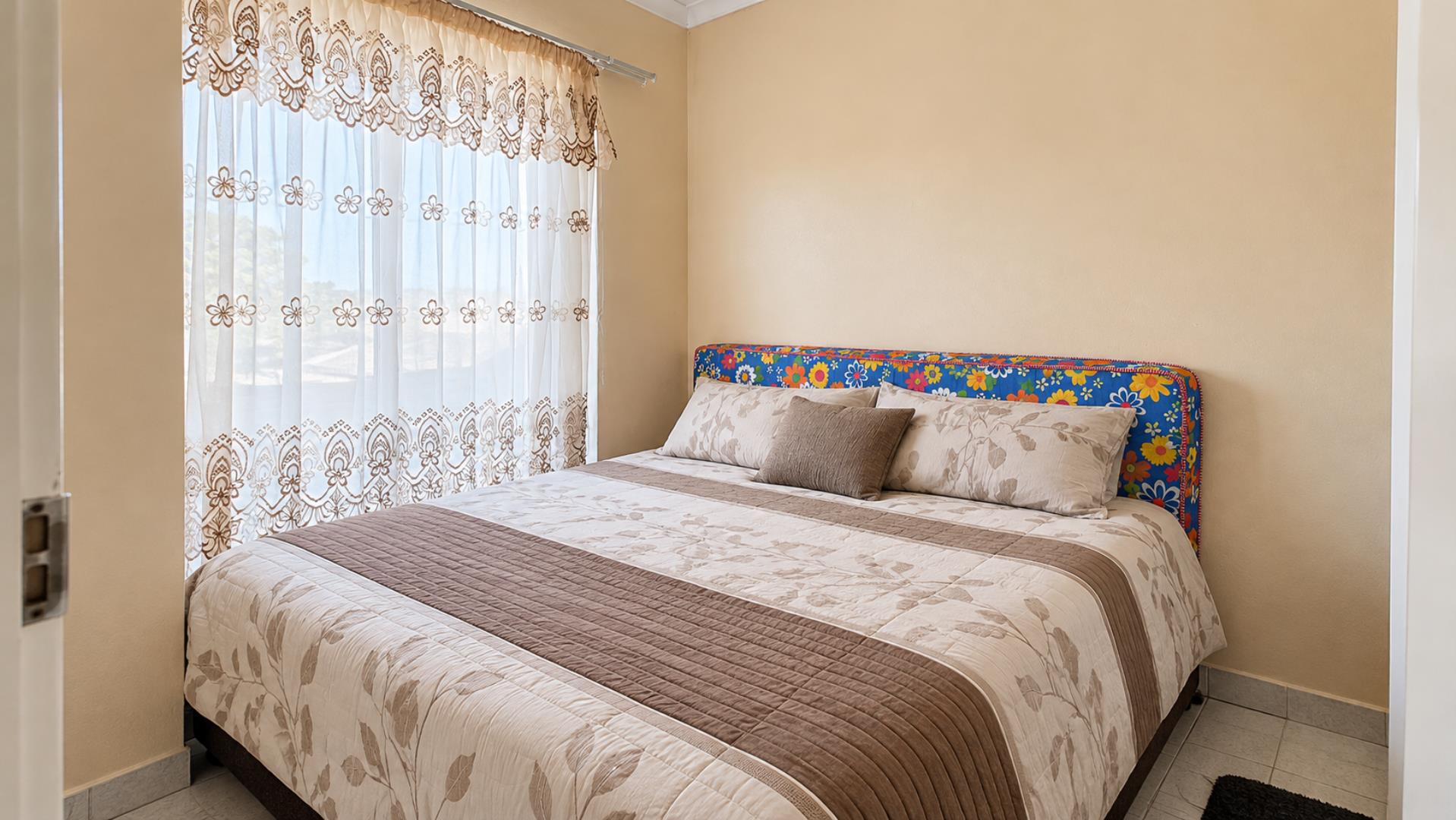 769695_Bright_Floral_Headboard_Bedroom.png
