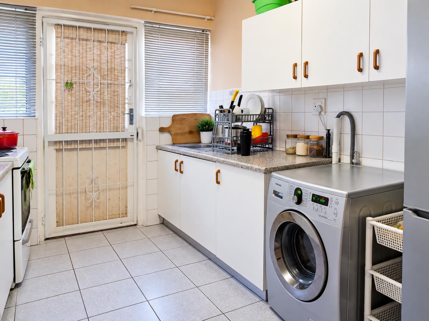 769695_Bright_Organised_Kitchen_Laundry_Room.png