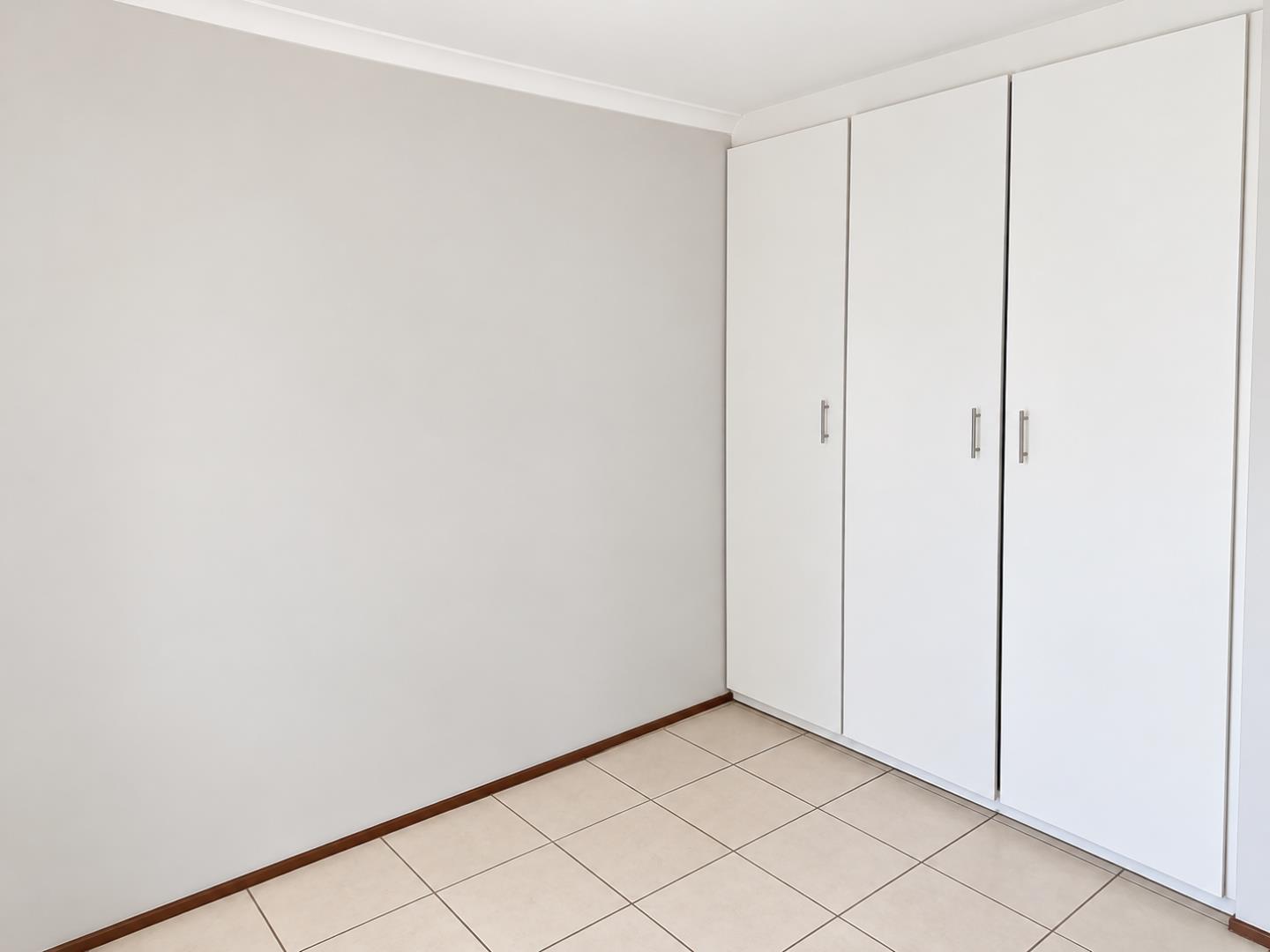 769803_Minimalist_Room_with_Built-In_Wardrobe.png
