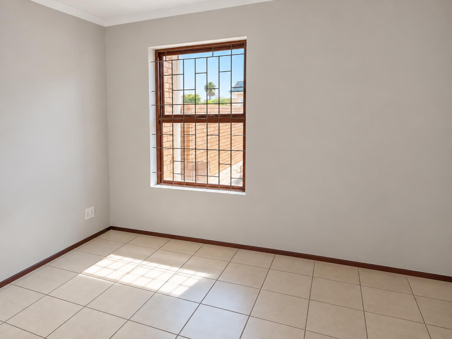 769803_Sunlit_Minimal_Room_with_Grilled_Window_(1).png
