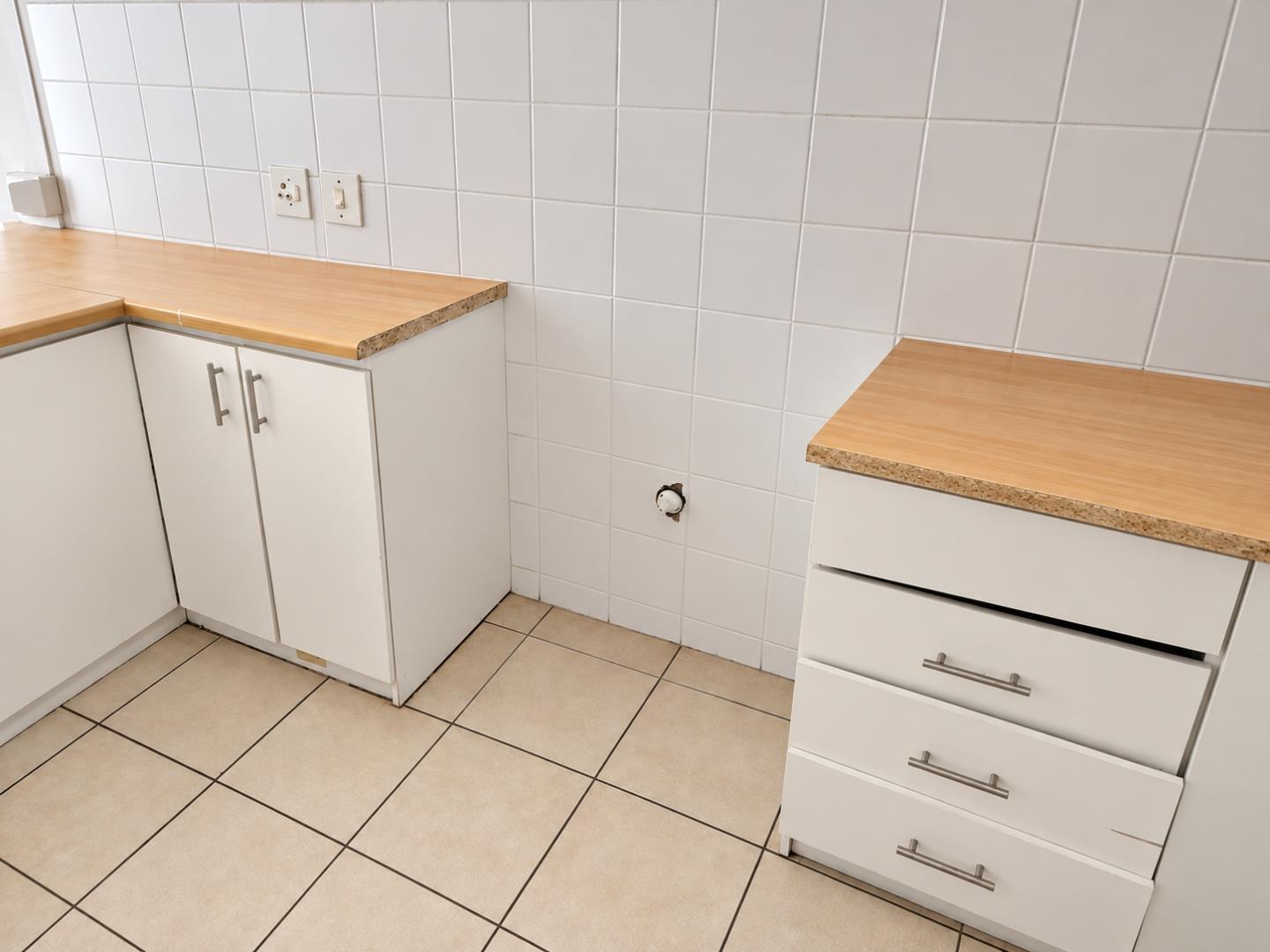 769803_Tidy_Minimalist_Kitchen_Utility_Corner.png