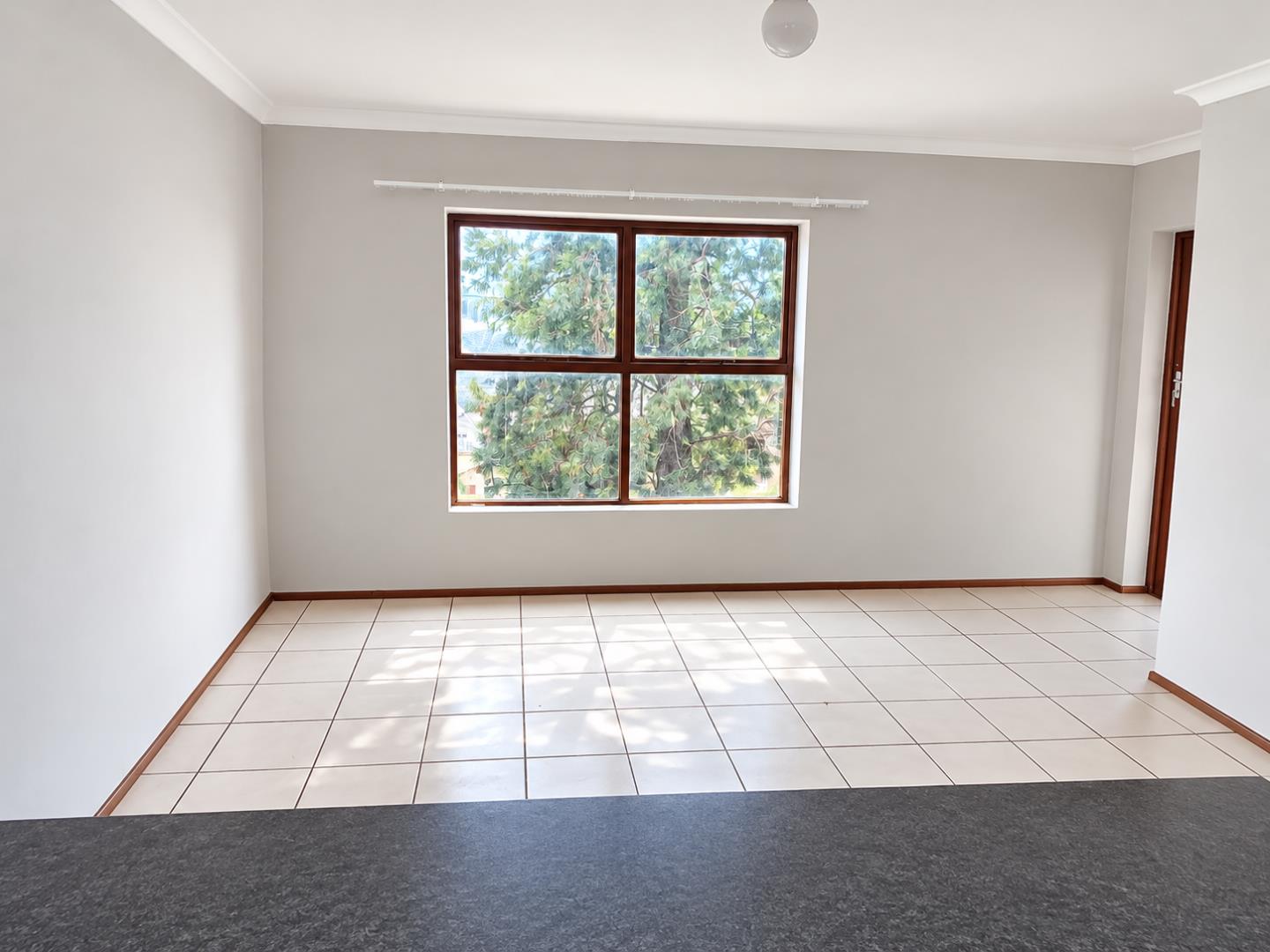 769852_Bright_Empty_Room_with_Garden_Window.png