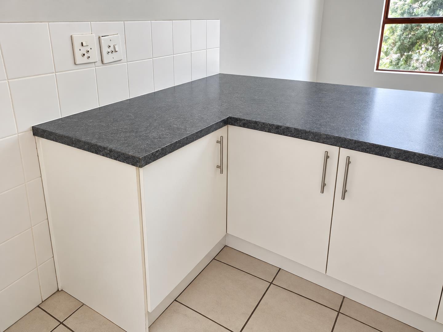 769852_Minimal_Kitchen_Counter_with_Window_View.png