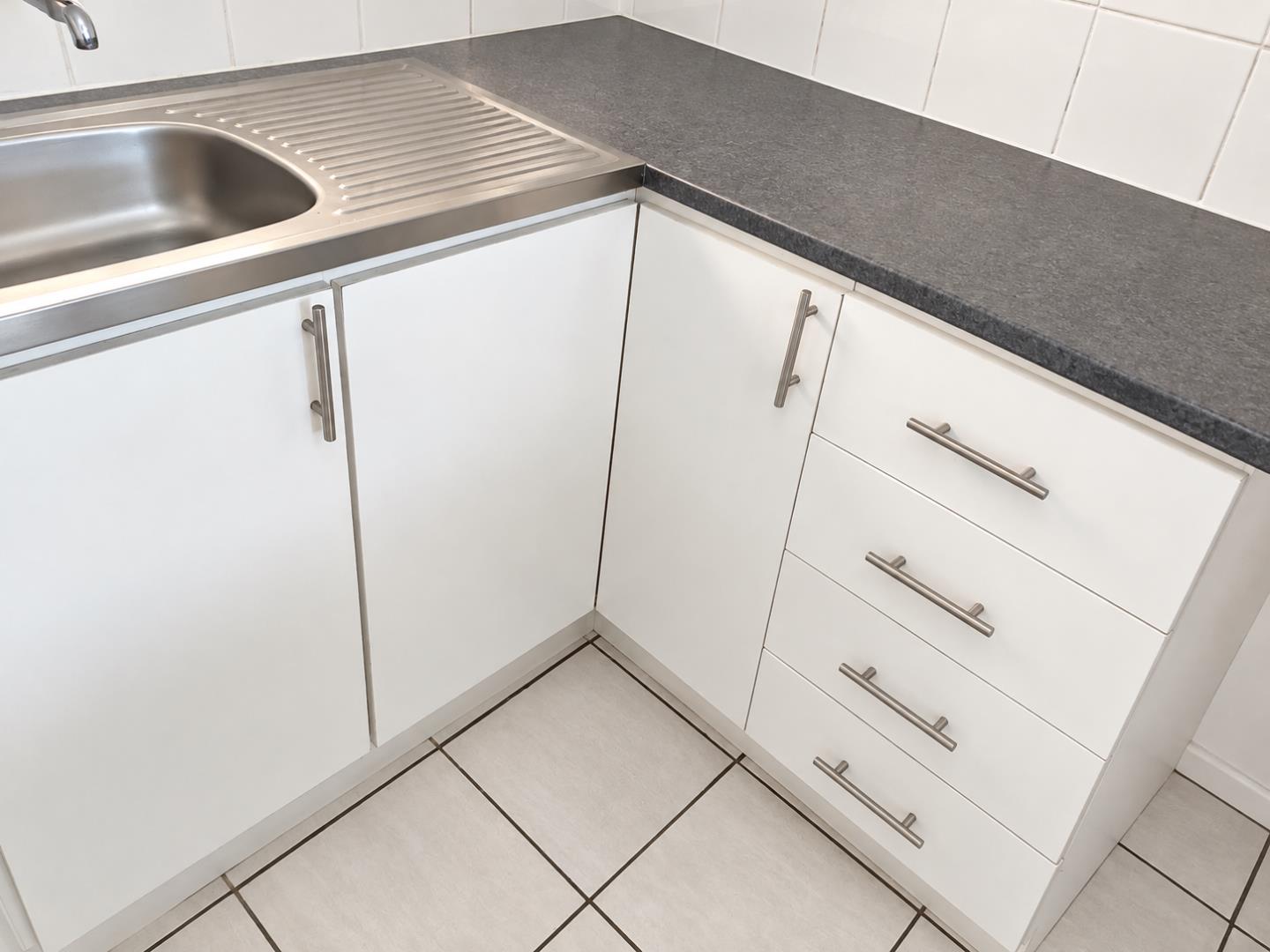 769852_Minimalist_Kitchen_Corner_with_Stainless_Sink.png
