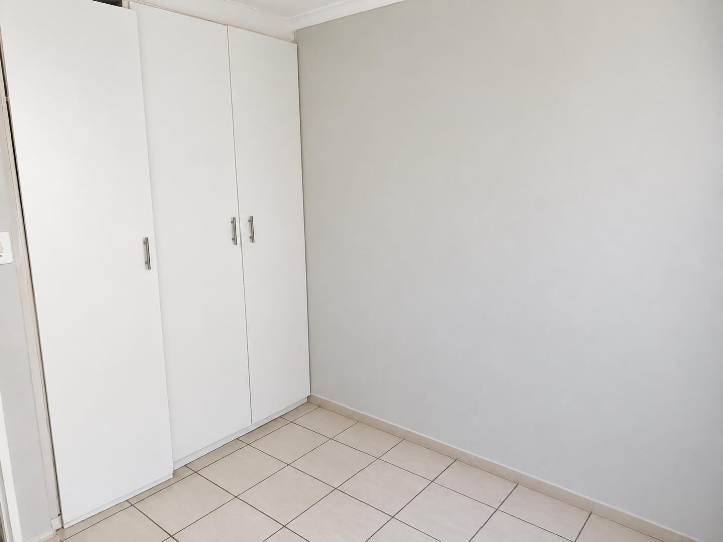 769852_Minimalist_Room_with_Built-In_Wardrobe.png