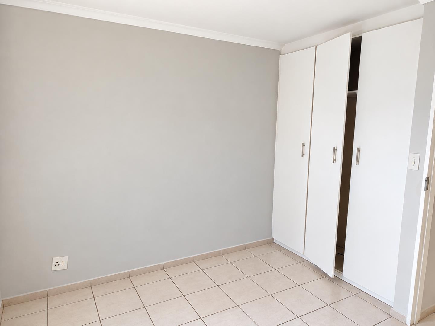 769852_Minimalist_Room_with_Open_Wardrobe.png