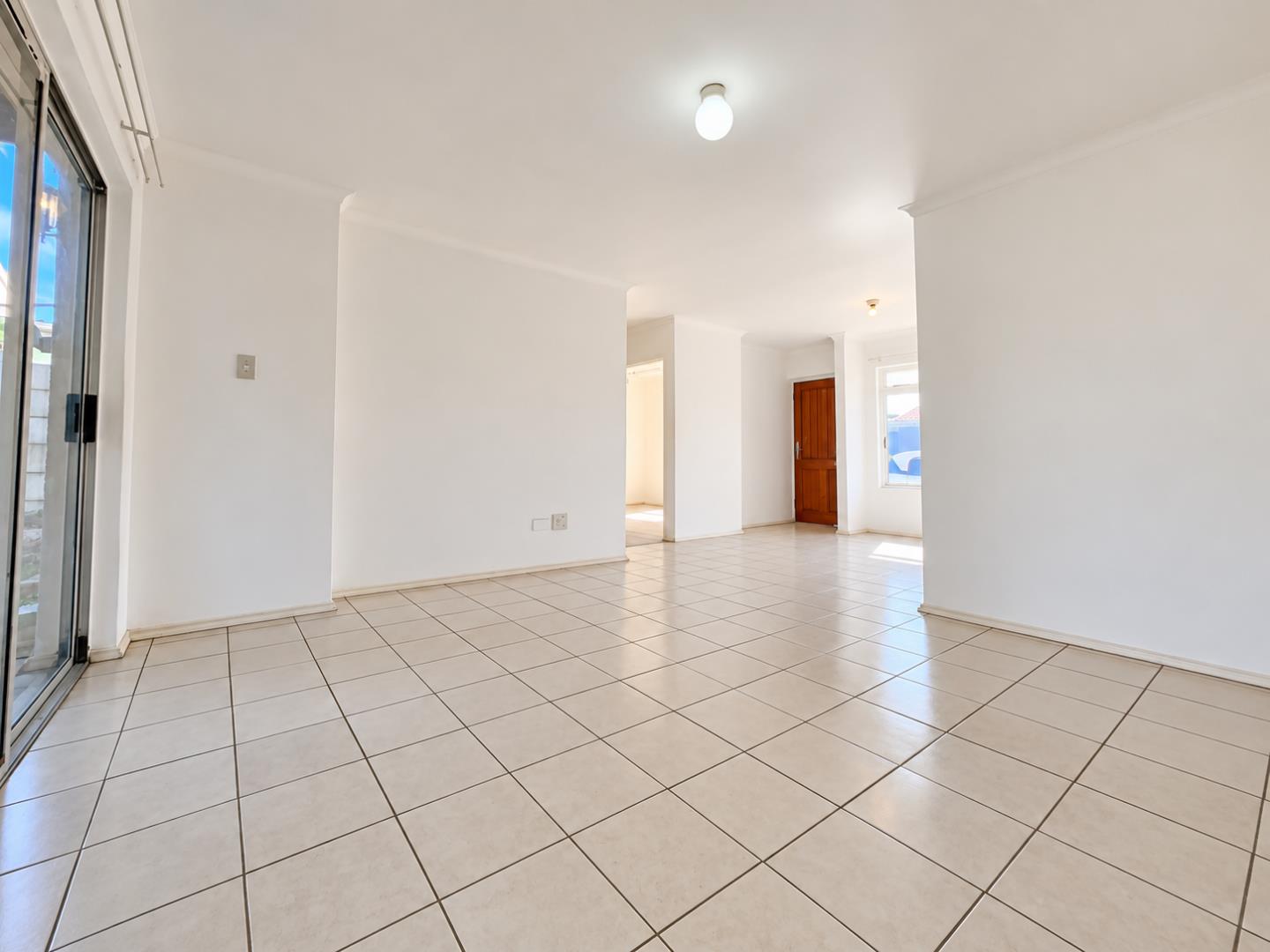 769853_Bright_Empty_Tiled_Living_Area.png