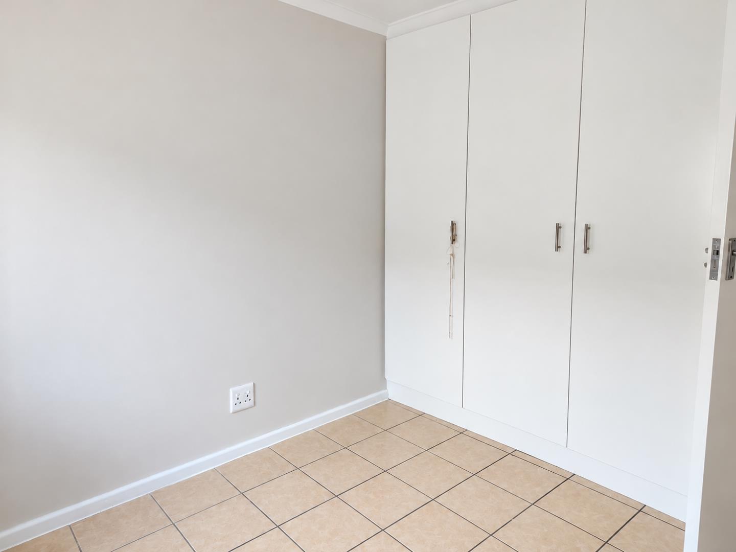 769856_Bright_Minimal_Room_with_Built-In_Wardrobe.png