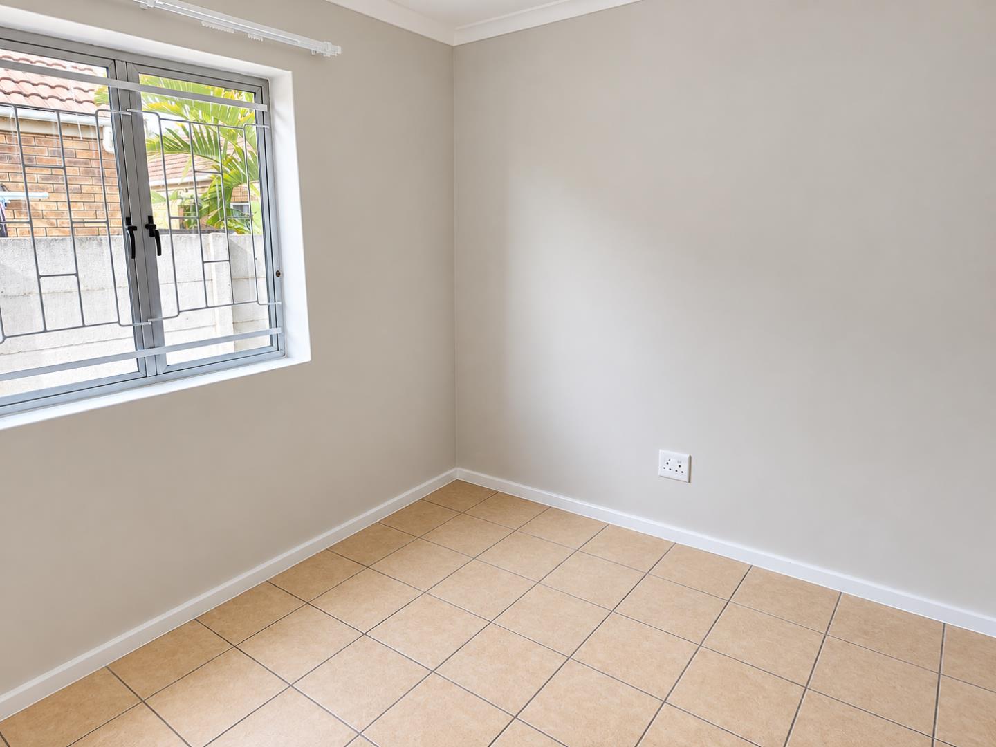 769856_Bright_Minimal_Room_with_Grilled_Window.png