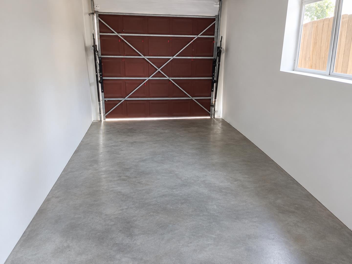 769856_Empty_Garage_with_Brown_Sectional_Door.png