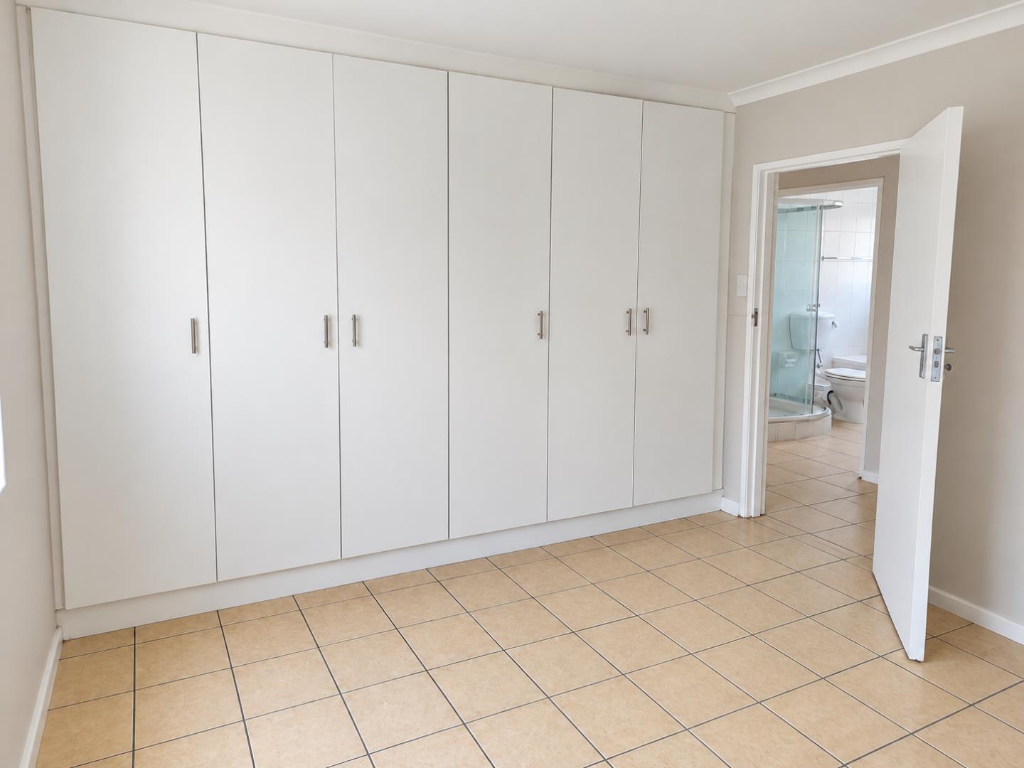 769856_Modern_Bedroom_with_Built-In_Wardrobe_and_Bathroom.png