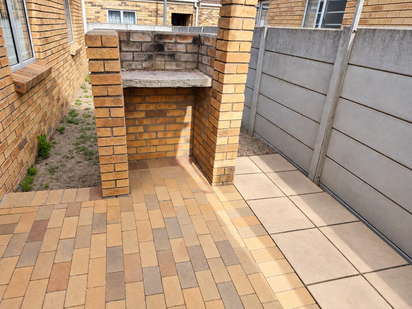 769856_Tidy_Sunlit_Backyard_Braai_Patio.png